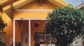 A yellow house with a blue sky